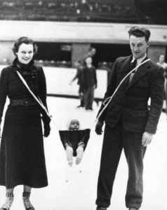 Couple Skating with Baby Carrying meme template