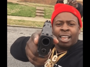 Black Guy Pointing Gun at Camera Threaten meme template