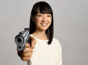 Marie Kondo pointing a gun At-you meme template