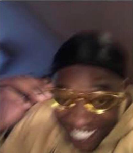 Black man putting on gold glasses Radial Blur meme template