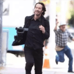 Keanu Reeves running with camera  meme template blank vs.