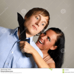 Woman holding up knife to man's throat  meme template blank Stock photo