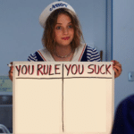 Robin holding ‘you rule you suck’ sign Stranger Things meme template