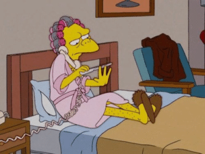 Moe filing nails in bed Simpsons meme template
