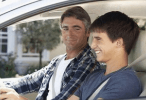 Dad talking to son in car Stock Photo meme template
