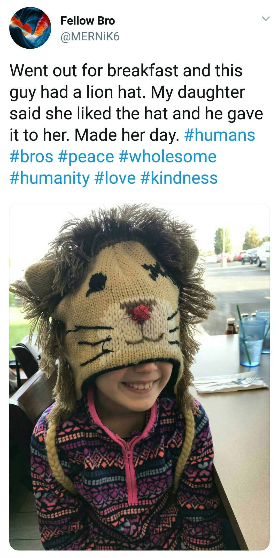 cute wholesome-memes cute text: Fellow Bro @MERNiK6 Went out for breakfast and this guy had a lion hat. My daughter said she liked the hat and he gave it to her. Made her day. #humans #bros #peace #wholesome #humanity #love #kindness 