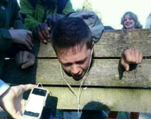 Forcing someone in stockade to listen to music IRL meme template