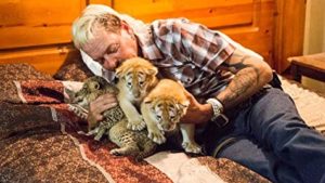 Joe Exotic and three baby tigers By meme template