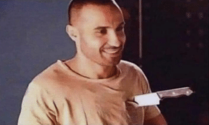 Man smiling with knife in chest Happy meme template